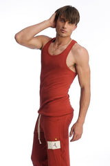 Red ribbed Sustain tank with scoop neckline paired with matching red cargo pants featuring a white thigh patch