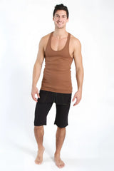 A man wearing a fitted chocolate brown sustain tank top with scoop neckline and black shorts from the front view