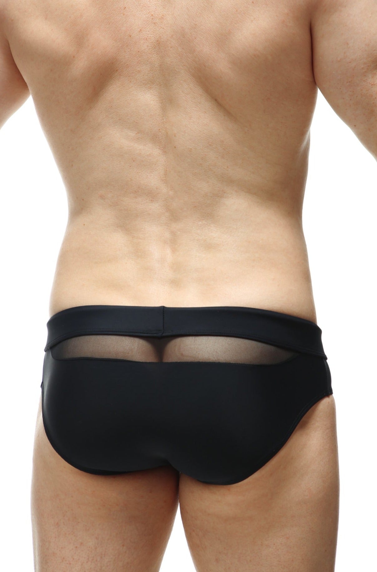 Back view of petitq swim bikini ajoupa black swim trunks with sheer mesh panel in black fabric