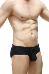 PetitQ swim bikini Ajoupa black swim trunks with drawstring waistband and small red logo on the side