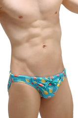 Bright blue swim bikini taik punta with playful pineapple watermelon and tropical drink pattern for beachwear