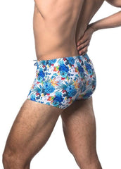 Tropics printed swim trunk with blue and multicolored tropical floral pattern designed for beachwear