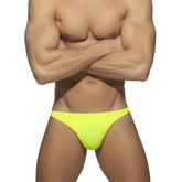 Bright neon yellow swimwear g-string made of smooth stretchy fabric shown from the back side