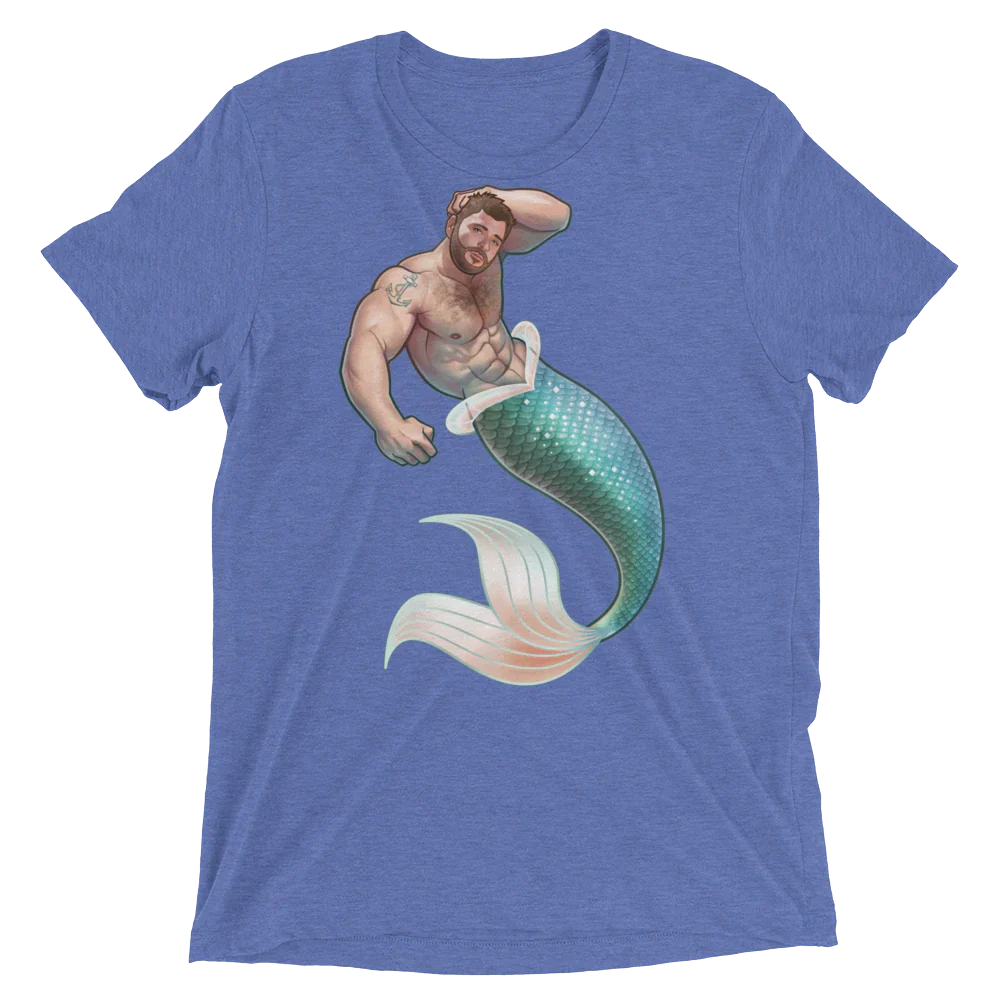 Blue heathered t-shirt featuring a muscular bearded merman with teal and white scaled tail from salt of the sea collection