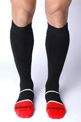 Take down knee high black compression socks with red toe caps white trim and cellblock13 logo on each foot