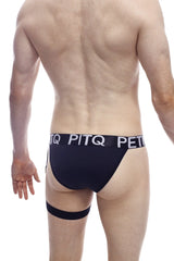 Black pitq branded briefs with matching leg strap in tanga petitq adventure black showing front view