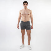 Black and white geometric patterned textured jacquard stretch knit chino shorts with zip pockets for men