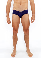 Deep blue velvet textured swim brief with a silver metallic x shaped front buckle for stylish swimwear