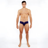 Navy blue textured swim brief with front buckle and metallic silver logo on waistband for men