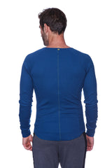 Thermal v-neck long sleeve royal blue athletic shirt with ribbed neckline and back zipper shown from the back side