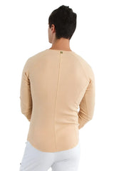 Beige thermal v neck long sleeve fitted shirt with subtle ribbed texture and central seam on back side