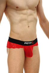 Thong Blécourt red men’s underwear with red lace trim and black waistband featuring the petitq logo
