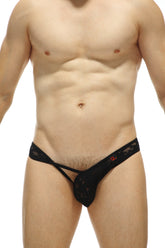 Black lace thong petitq thong lasso lace black with a subtle red logo on the waistband viewed from the back