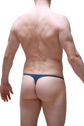 PetitQ thong Plellis prussian blue dark blue seamless thong with smooth design shown from the back side