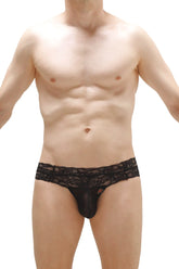 Black lace-trimmed men’s thong plessis lace black with sheer, form-fitting design shown from the back side