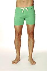 Transition yoga short in bamboo green with mint green fabric, cream drawstring tie, and two front pockets