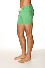 Green men’s transition yoga shorts with white drawstring bamboo green fabric and two front pockets