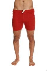 Transition yoga short in cinnabar red featuring a white drawstring and two side pockets for athletic use