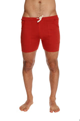 Transition yoga short in cinnabar red featuring a white drawstring and two side pockets for athletic use