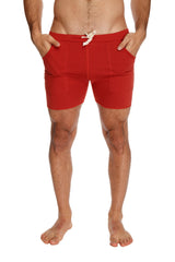 Transition yoga short in cinnabar red with drawstring waistband and side pockets designed for athletic use