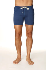 Navy blue transition yoga short with white drawstring and front pockets designed for athletic use