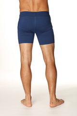 Navy blue transition yoga short with smooth form-fitting fabric and elastic waistband for athletic use