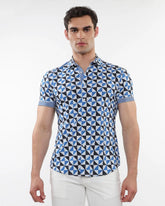 Blue and black geometric patterned short sleeve performance shirt with striped cuffs for casual wear
