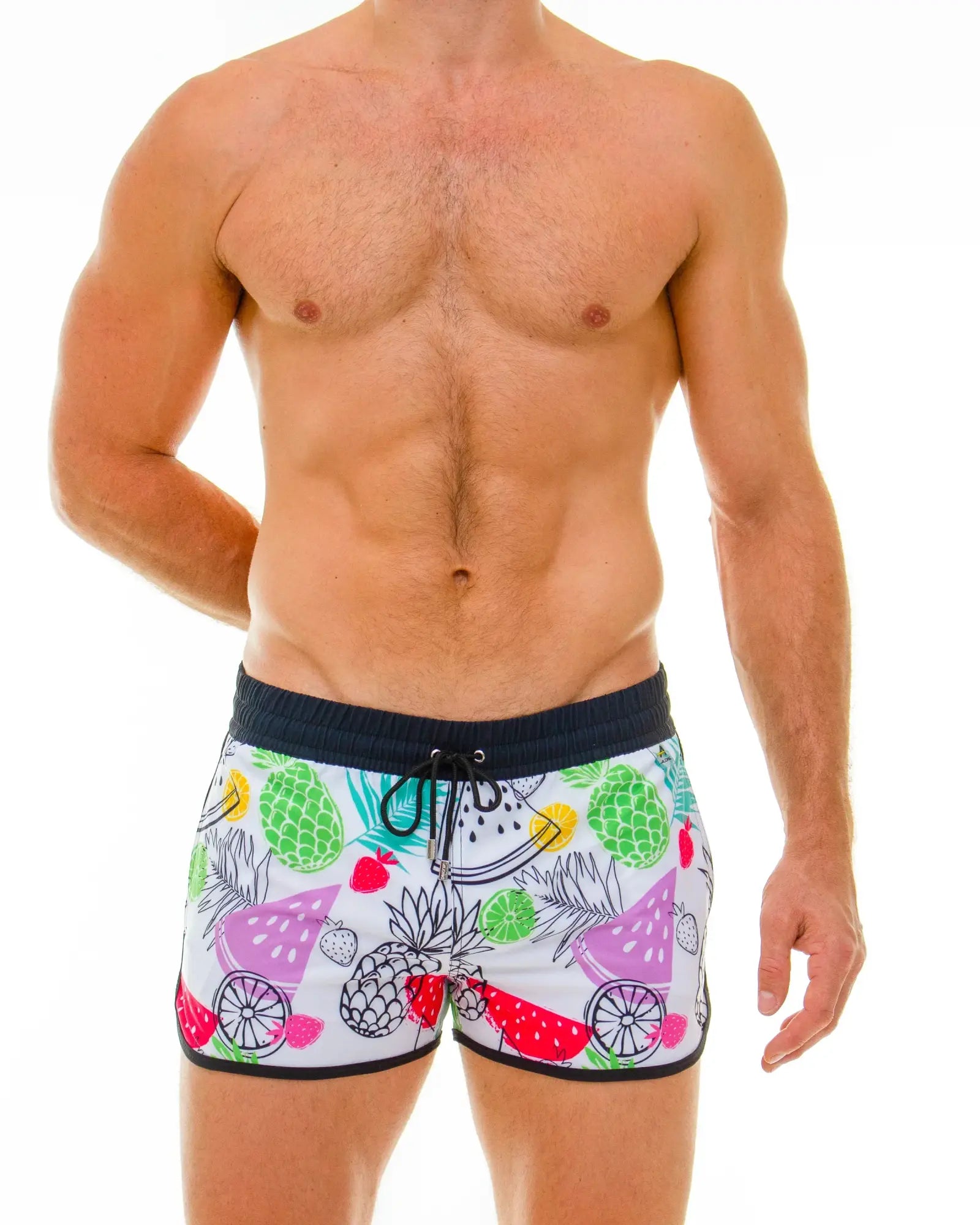 White tropical fruit swim short with colorful pineapple watermelon and strawberry print perfect for beachwear