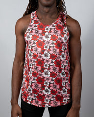 A vibrant red pink and white floral print hawaiian hibiscus tank top with a round neckline perfect for summer wear