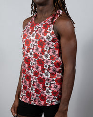 A vibrant red pink and white Hawaiian hibiscus print tank top with racerback design made of lightweight fabric