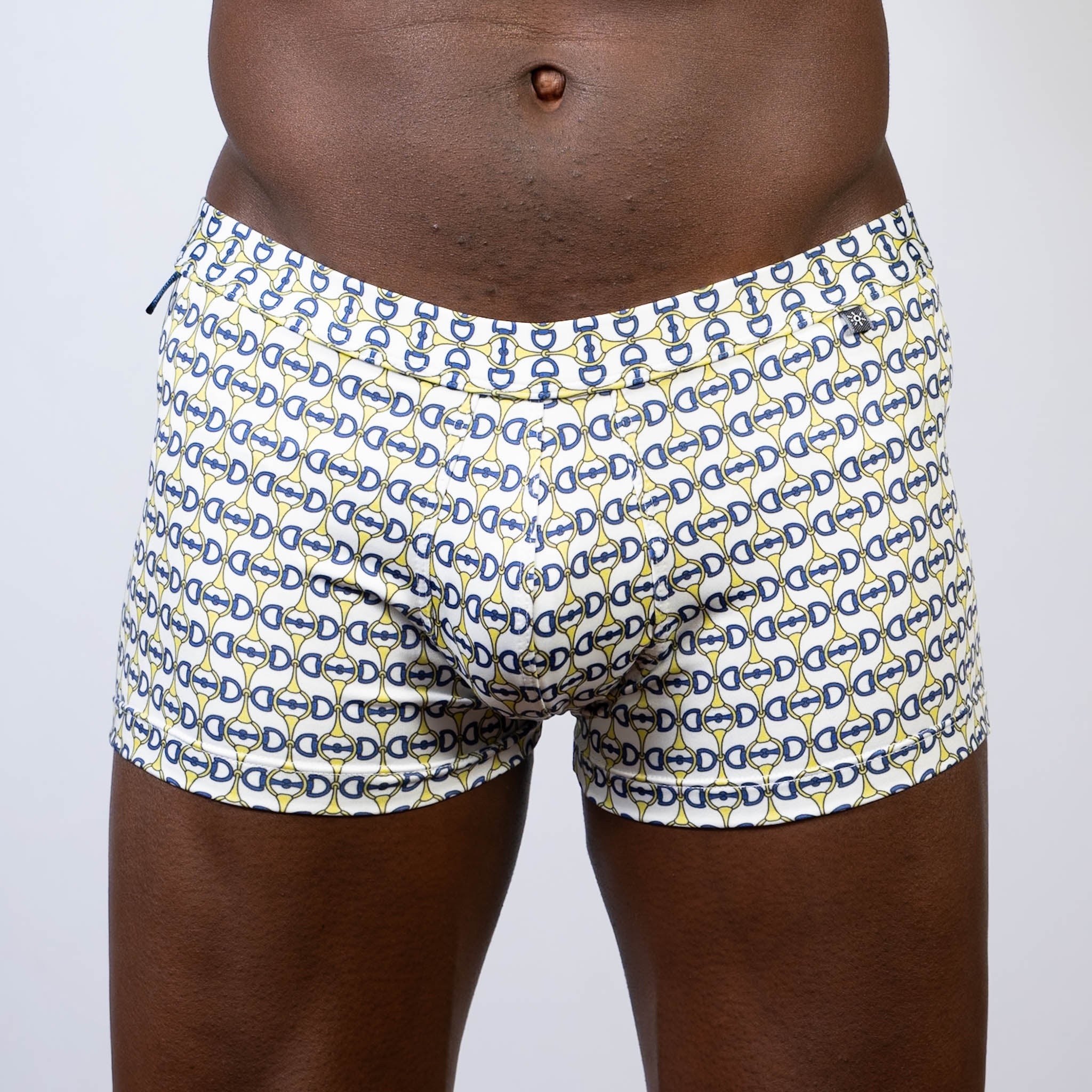 White boxer briefs with a repeating navy blue and yellow horseshoe buckle print designer square cut trunk