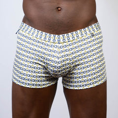 White boxer briefs with a repeating navy blue and yellow horseshoe buckle print designer square cut trunk