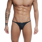 Black ustation thong bikini with sleek form-fitting design in stretch fabric for stylish swimwear look