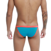 Bright turquoise and coral men’s briefs u station frisa bikini with a snug, form-fitting design