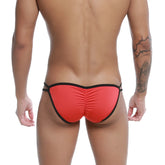 Back side of red and black u-station skeleton bikini thong with ruched back and elastic waistband designed for swimwear