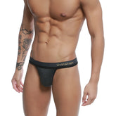Black ustation talent thong with subtle heathered texture and gold lettering on the waistband front side