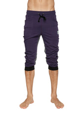 Ultra-flex tri-color cuffed yoga pant in eggplant with black drawstring waistband and ribbed cuffs shown from front