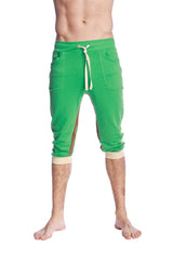 Green ultra-flex tri-color cuffed yoga pant featuring capri-length joggers with beige drawstring and matching cuffs