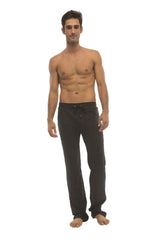 Black ultra flex cotton joggers with drawstring waist and elastic cuffs designed for yoga and track use