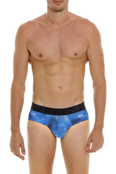 Blue galaxy-patterned men’s briefs with black elastic waistband featuring the Unico brand name in color 46-blue