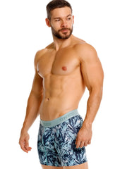 Men’s blue and teal tropical leaf pattern boxer briefs with light gray unico elastic waistband in color 43-Blue