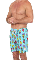 A man wearing light blue swim shorts with a colorful popsicle pattern and a drawstring waist against a white background.