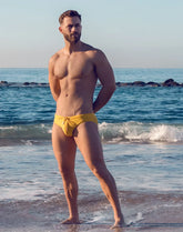 Bright yellow v10 ripple textured swim brief with drawstring waistband designed for swimming and beachwear