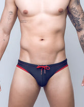 Navy blue V22 Rapid swim brief with red trim and matching red drawstring tie designed for quick drying