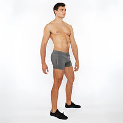 Gray vault gym-tech shorts with drawstring waist and subtle vertical stripes featuring 3 color heat weld zippers