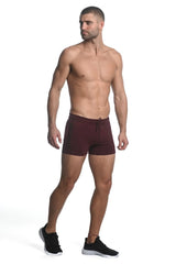 Maroon vault gym-tech stretch shorts with black side panels heat weld zippers and drawstring waistband for athletic use