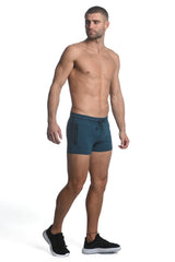 Teal vault gym tech stretch shorts with heat weld zippers featuring drawstring waist and side zipper pockets