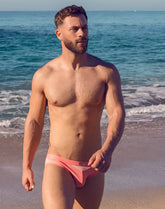 Vb13 swim brief pink swim trunks with subtle white stripe detail designed for comfortable beachwear