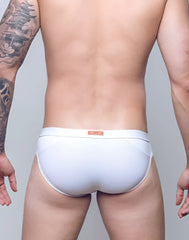 White VB13 swim brief with subtle elastic waistband and small orange label on the back side