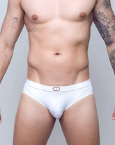 White vb13 swim brief with subtle elastic waistband featuring two interlocking ring motifs